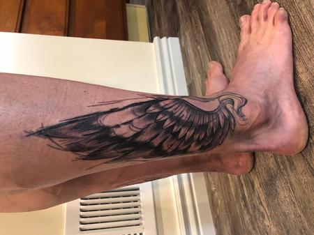 Ashes Bardole - brushed feather wings ankle tattoo